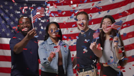 Woman-At-Home-Hanging-Up-American-Stars-And-Stripes-Flag-Bunting-For-Party-Celebrating-4th-July-Independence-Day-3