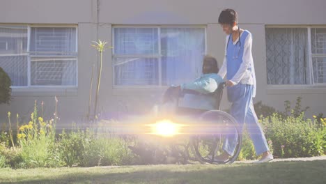 animation of light moving over female nurse pushing senior in wheelchair