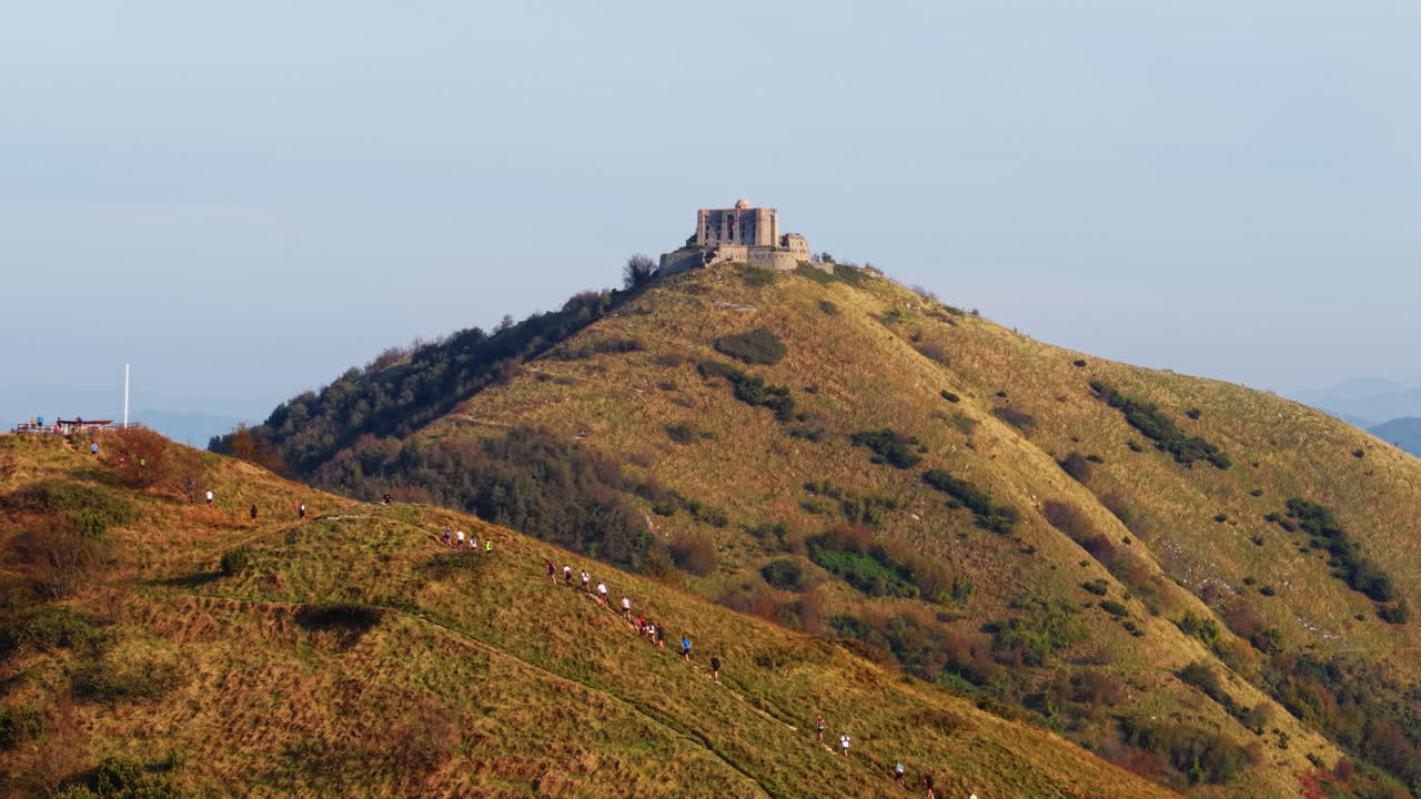 Trail Runners Ascending to Historic Fort Autumn Italy Mountain Aerial