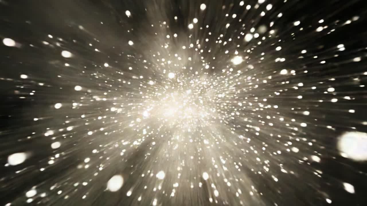 A mesmerizing visualization of particles bursting into a cosmic explosion, showcasing dynamic movement and an expansive display of glowing lights against a dark backdrop