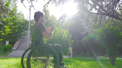 disabled youth sitting in a wheelchair praying.