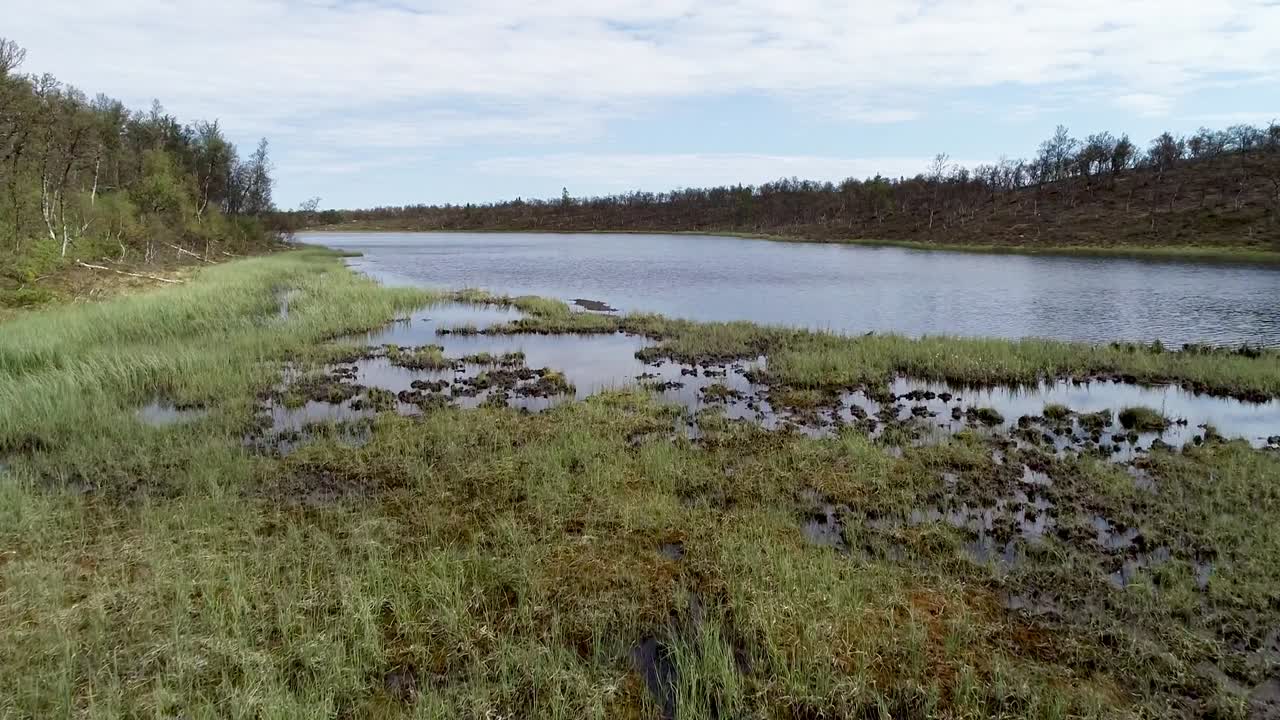 Scenic flight over a lake in the mountains