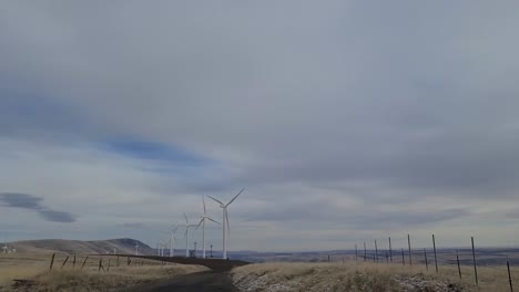 driving past wind farm on a cloudy day