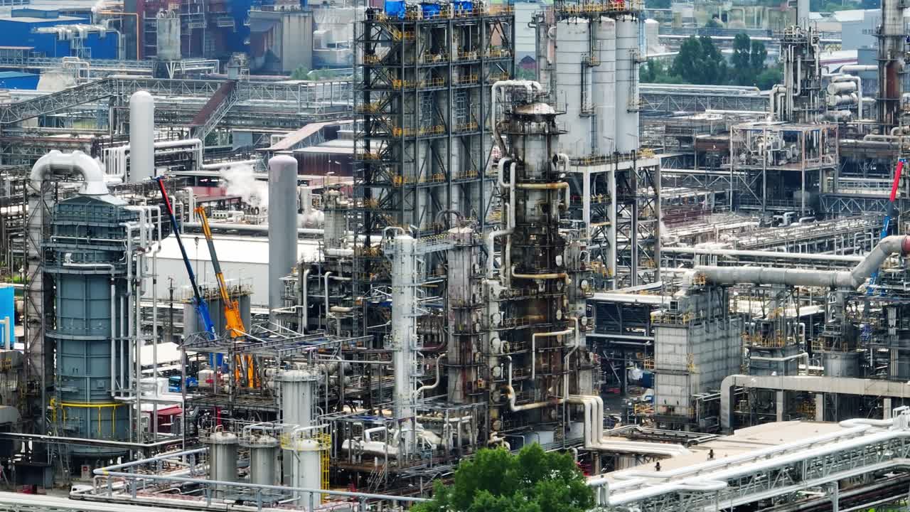 Pipes and constructions in petrochemical industry plant - aerial drone view 