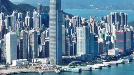 4k tele zoom view of hong kong central district - slow pan aerial view angle from sky.