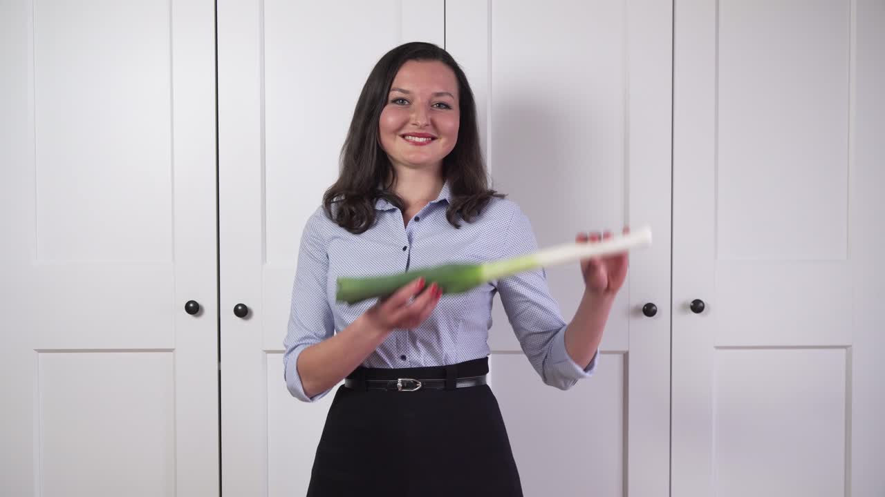 Pretty business girl catching vegetable, symbolism of healthy lifestyle