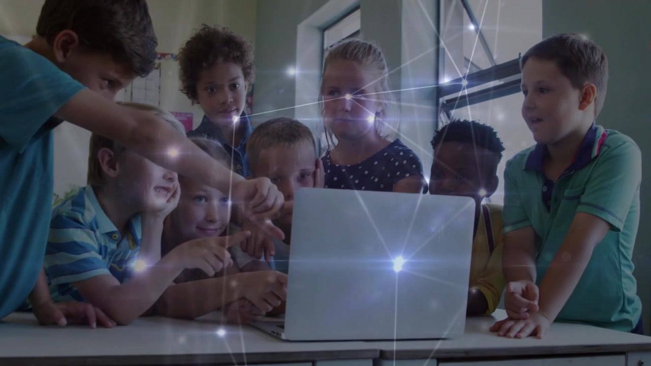 Eight kids gathering around laptop, pointing and tapping as bright flare sparking inspection