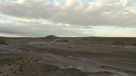 A-barren-desert-wasteland-at-sunset---aerial-push-forward