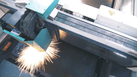 machine cutting metal in factory. hi-technology manufacturing