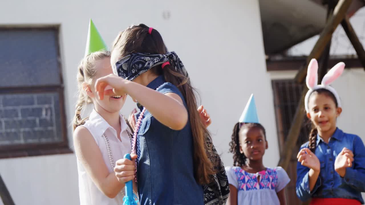 Happy friend playing blindfold in backyard 4k