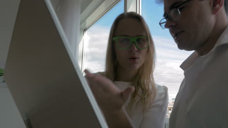 businesspeople with electronics in city office