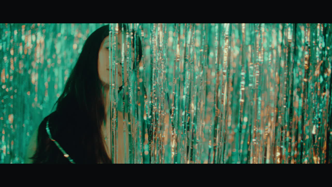 Woman Behind Gold Tinsel