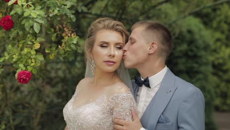 newlyweds. caucasian groom with bride in the park. wedding couple. happy family