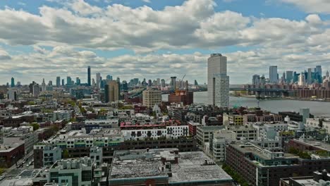 aerial panoramic shot of new york city skyline with brooklyn district during cloudy day, usa - wide shot