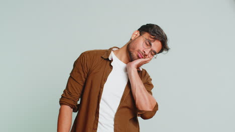 Tired exhausted Indian man yawning, lazy bored lack of sleep, falling asleep, take a break, relax
