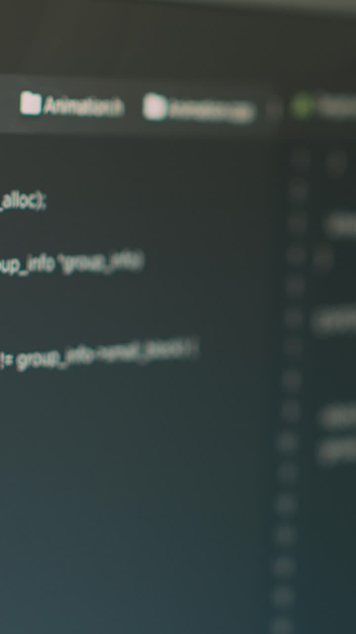 Vertical video: Program code and online cloud database on computer screen
