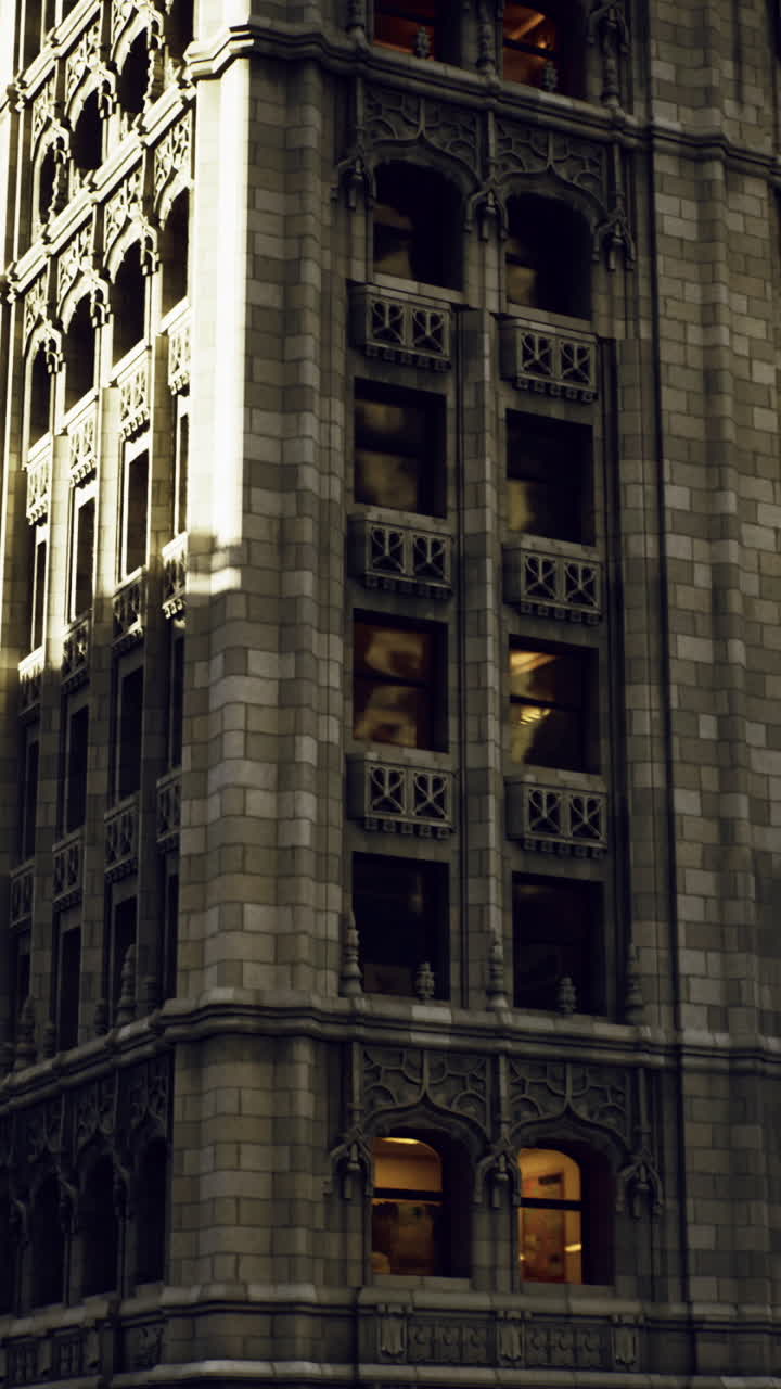 Historic architecture illuminated at night in a bustling urban area