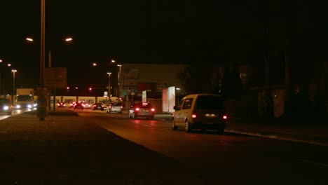 traffic on a busy road at night time in eastern suburb berlin, germany