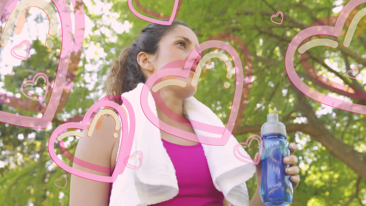 Drinking water outdoors, woman with pink heart animation overlay visible