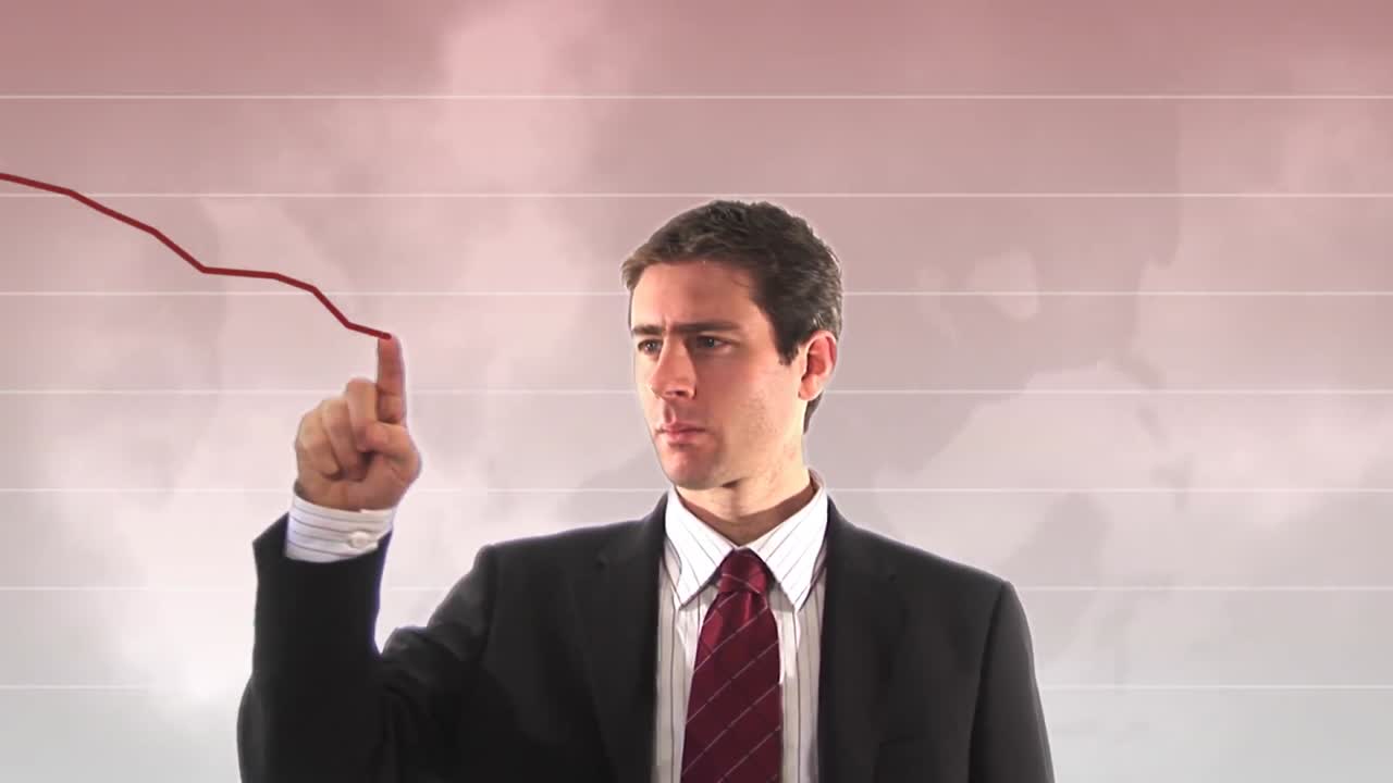 하향 그래프를 보여주는 사업가의 주식 영상