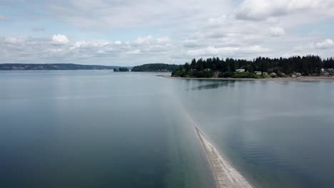 aerial view of a sandbar in a calm bay