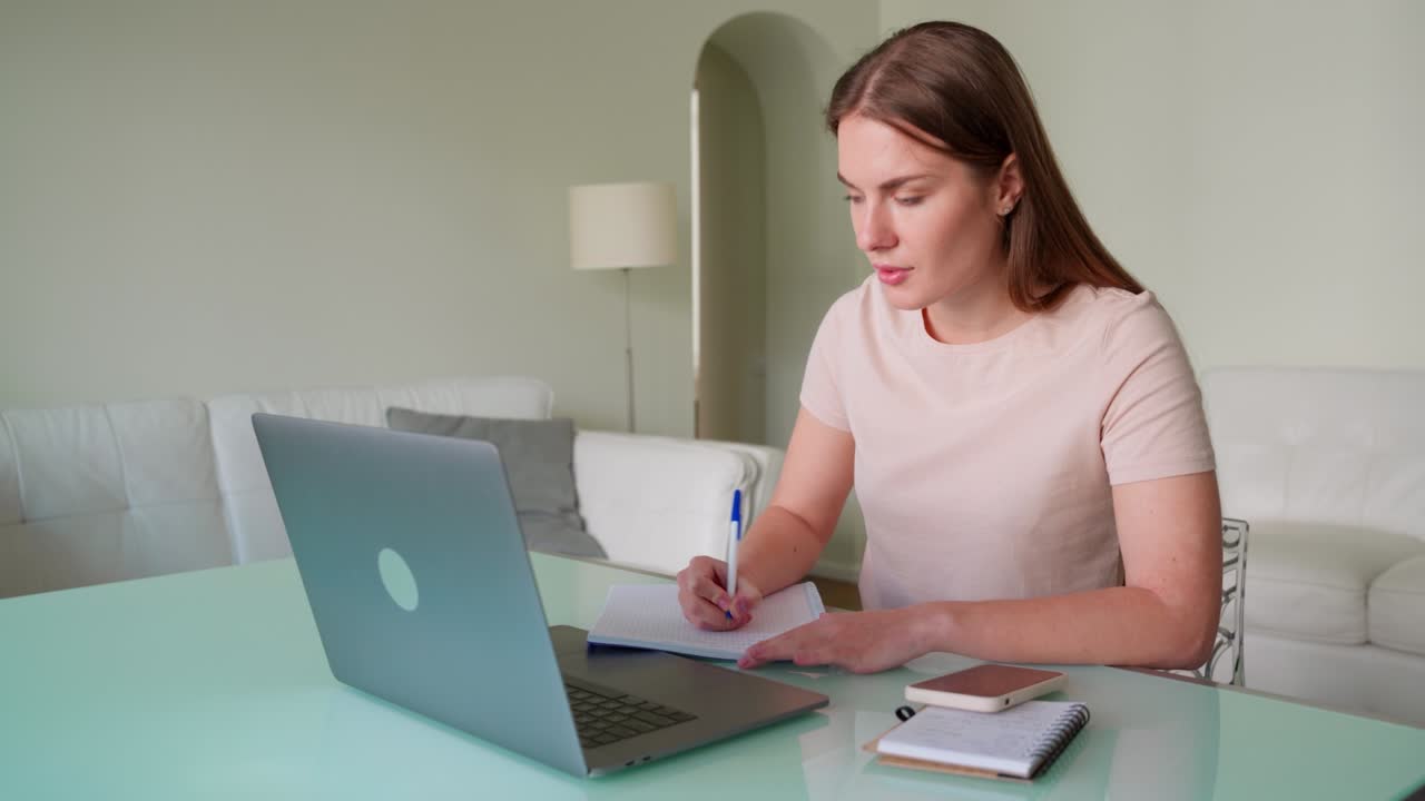 Young mature woman using laptop for online education