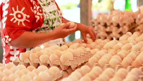 person sorting eggs at a floating market