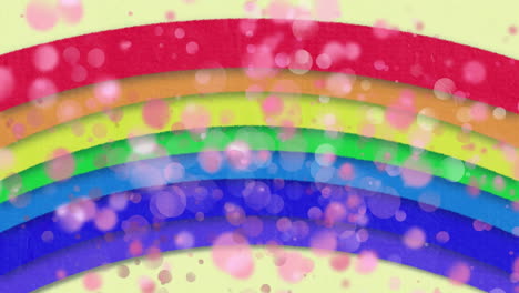 animación de un arco iris brillante con múltiples manchas rosadas parpadeantes