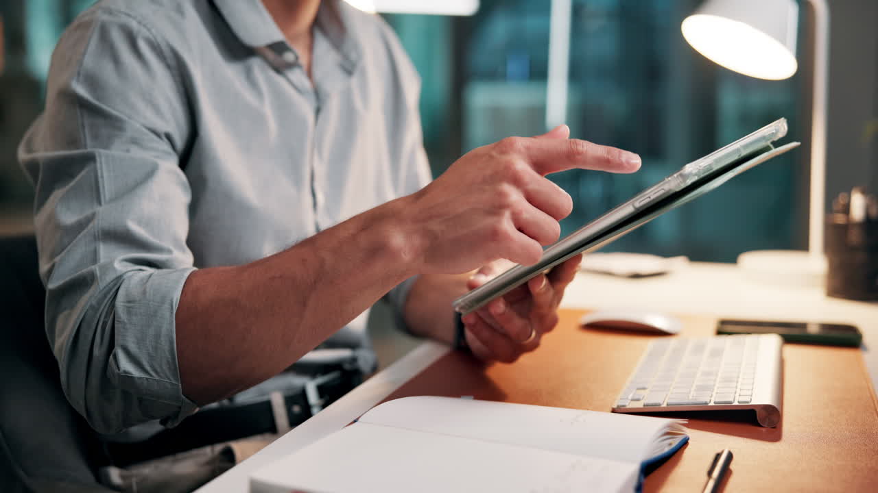 Professional Man Using Digital Tablet at Office Desk
