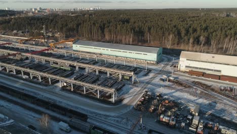 aerial view of big round metal pipes in metal warehouse.