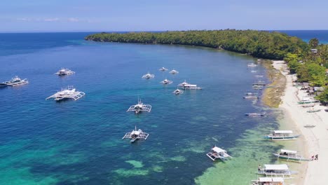 Turquoise-paradise-Boracay-island-Philippines-with-tourist-Banca-boats