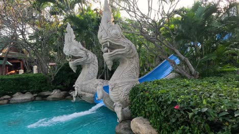 person sliding down a twisting water slide