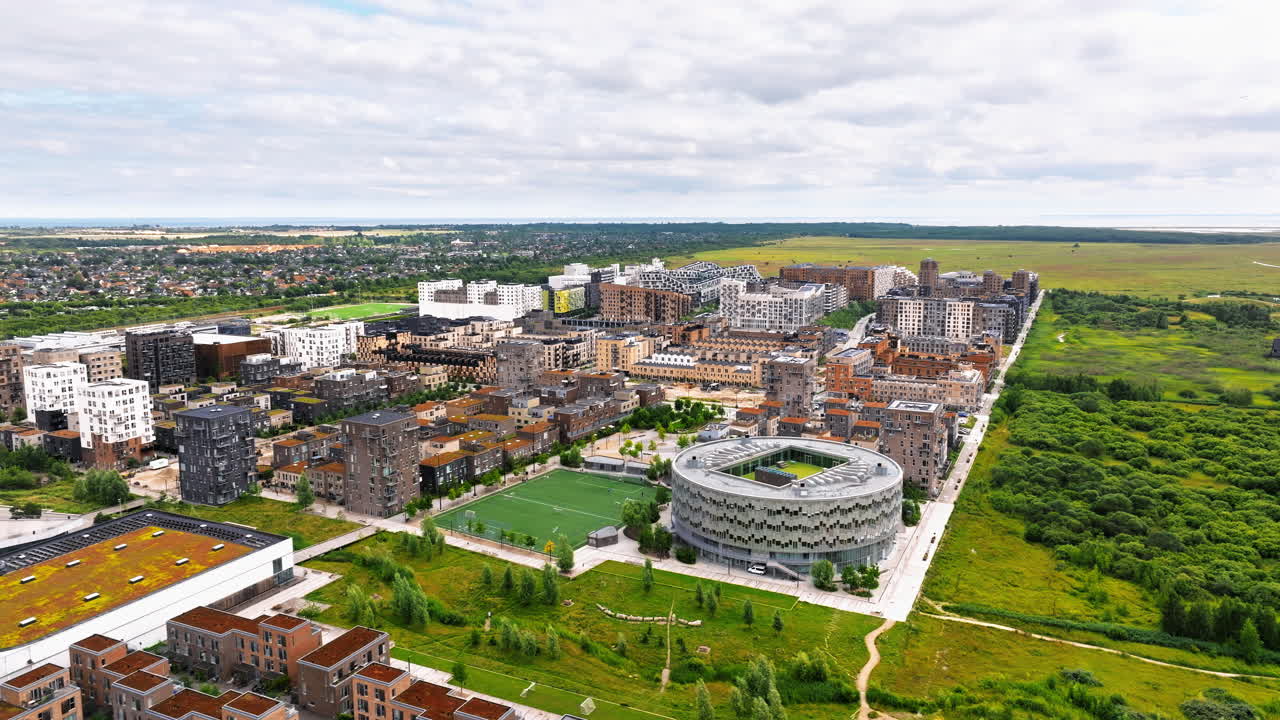 Aerial drone view of the Orestad developing city area in Copenhagen, Denmark on the island of Amager