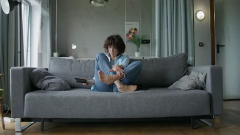 woman relaxing on a sofa