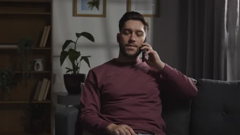 disappointed man at home receiving phone call telling him he has been unsuccessful in job interview 5