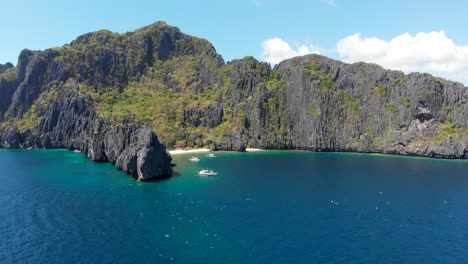 aerial panning view of tropical islands, mountains and emerald sea, el nido, palawan, philippines