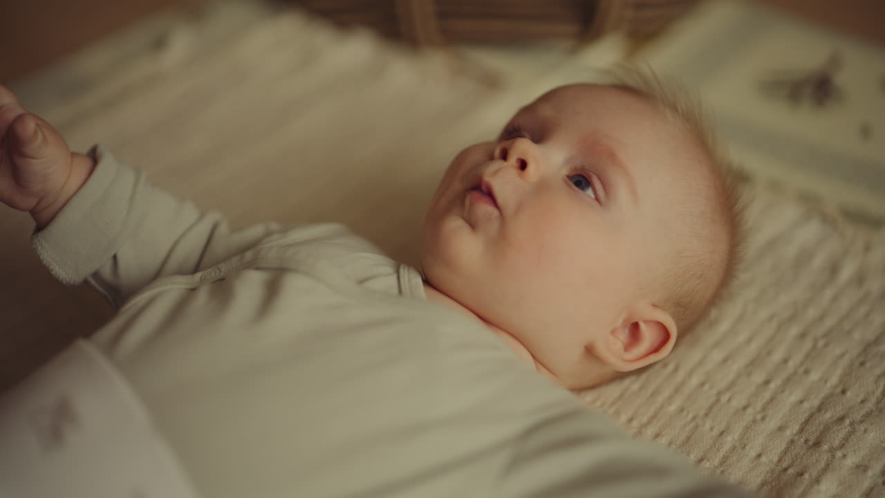 Baby Boy Lying on Blanket Looking at Parent