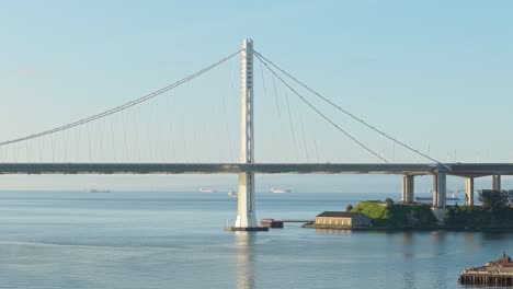 a static aerial view of the san francisco bay bridge from treasure island.