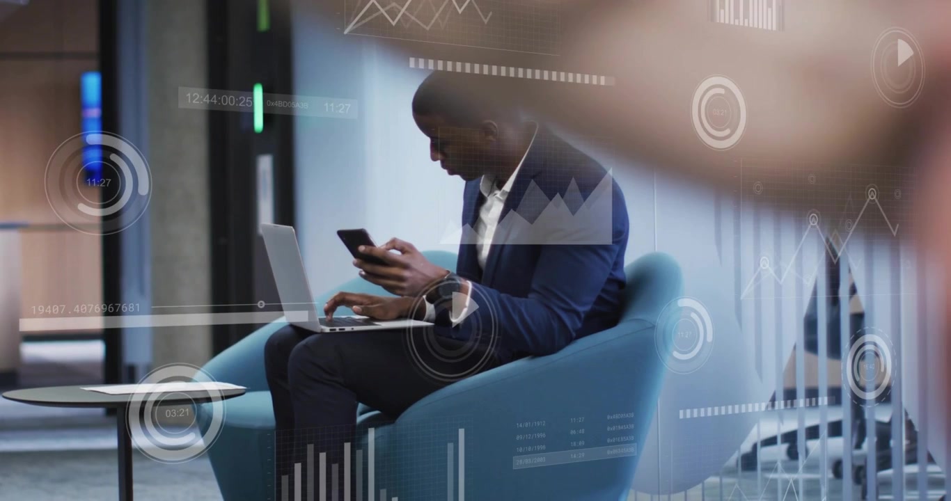 Vertical video: Switching man in navy blazer reading phone, typing laptop while using HUD at lounge