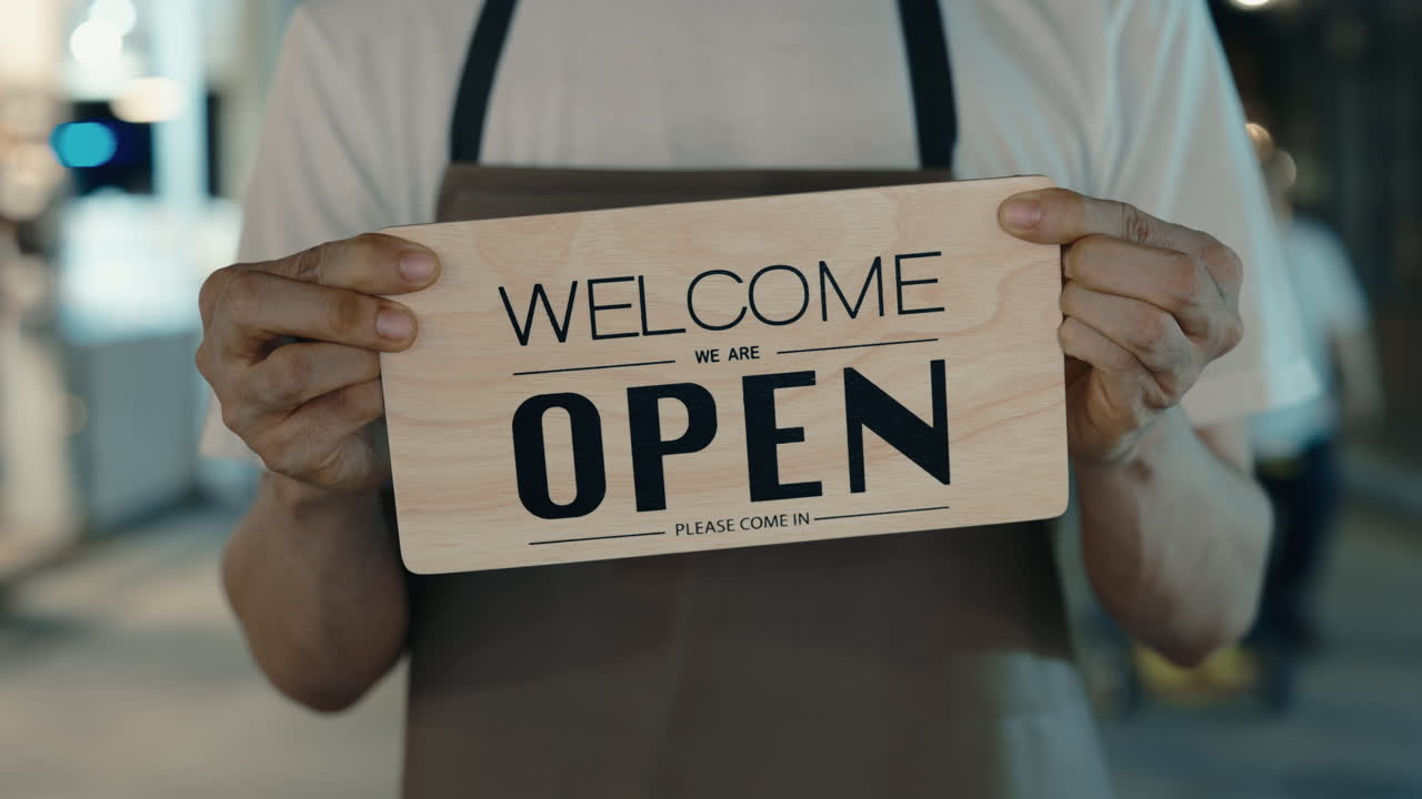 Person Holding Open Sign