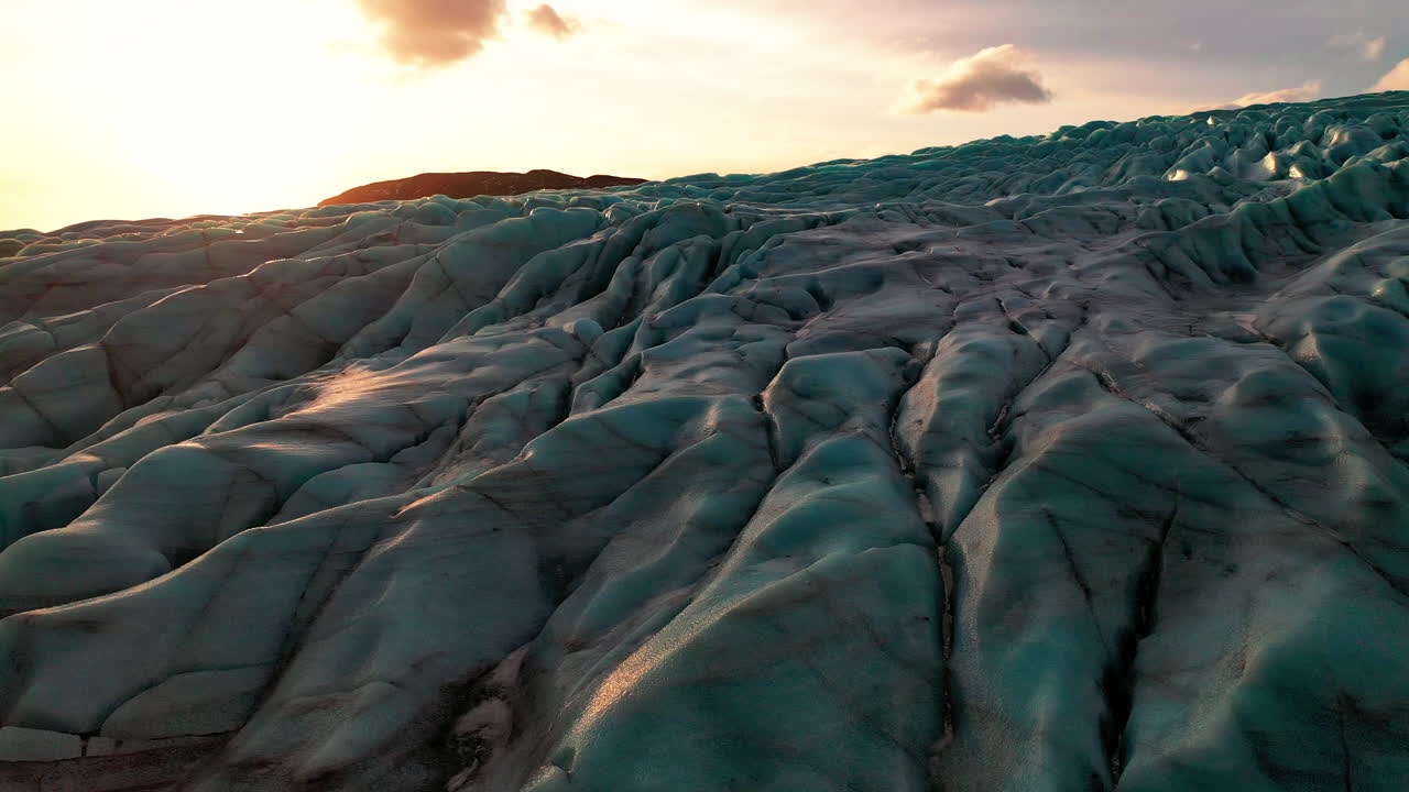 The Amazing Ice-Carved Landscape At Falljokull Glacier Outlet In South Iceland On A Sunset - ascending drone shot