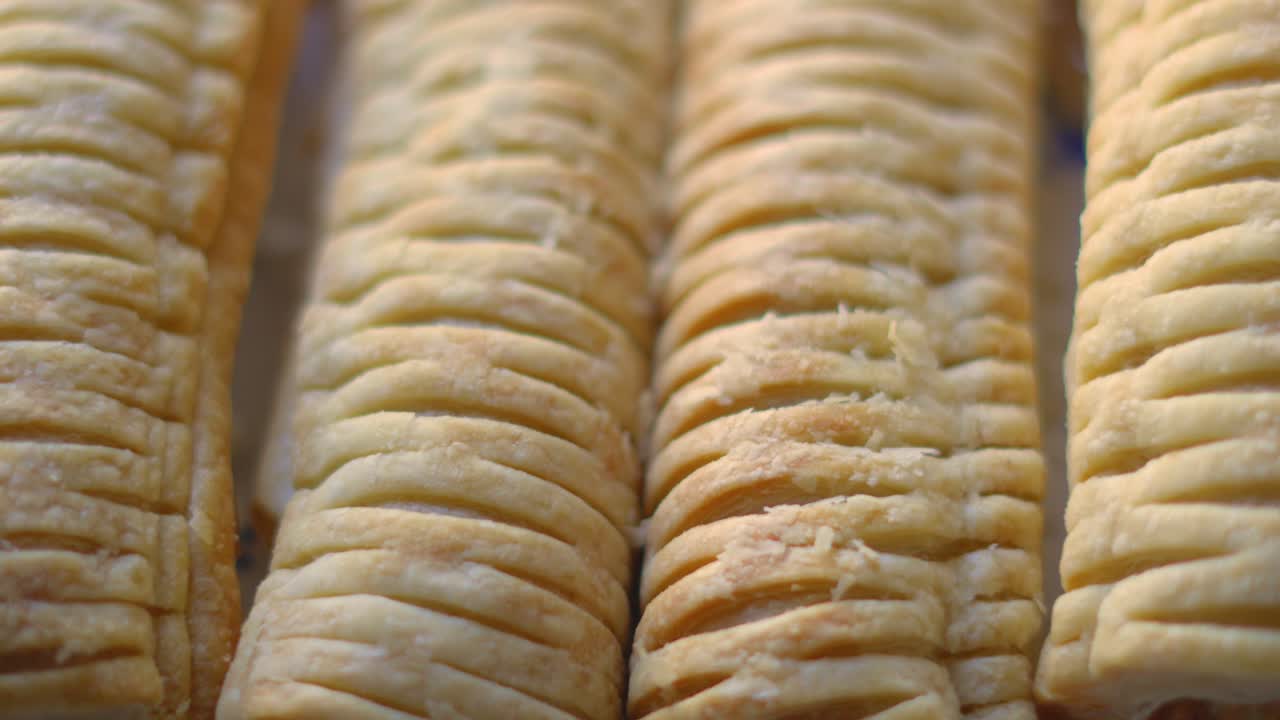 Overview of Sausage Rolls on Plate After Baking. Delicious Traditional English Fresh Bakery Product. British Snack Cuisine. Pork Meat Wrapped in Puff Pastry.