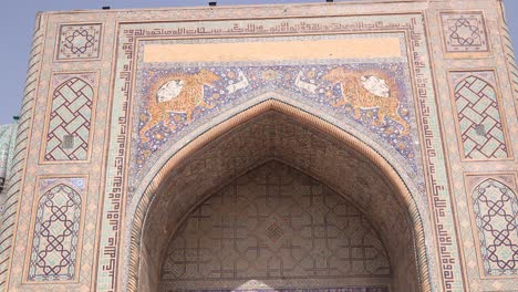 bright contrast on detailed tiling archway of a madrassa in registan square in samarkand, uzbekistan along the historic silk road