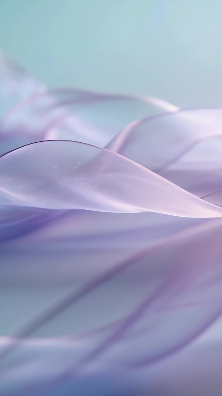 Vertical video: Shifting soft light sending sheer ribbons waving in studio closeup showing thread