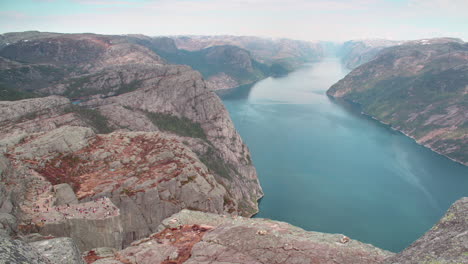 a cinematic view of cliff preikestolen in fjord lysefjord - norway - nature and travel background time lapse