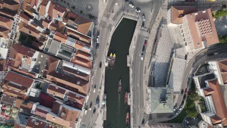 moliceiros with tourists on busy ria de aveiro urban canals