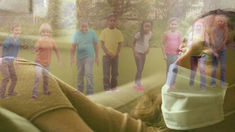 caucasian woman wearing face mask against group of kids running at the park