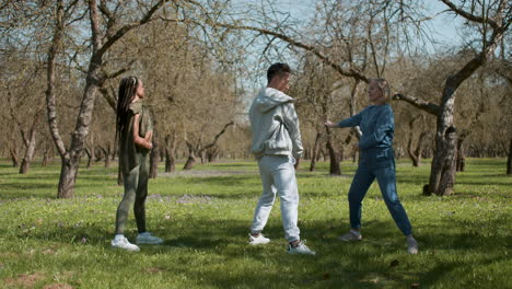 people stretching in the forest