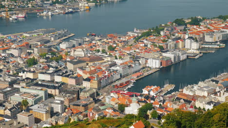 a view of the city of bergen below are the marinas and large cruise ships 4k video