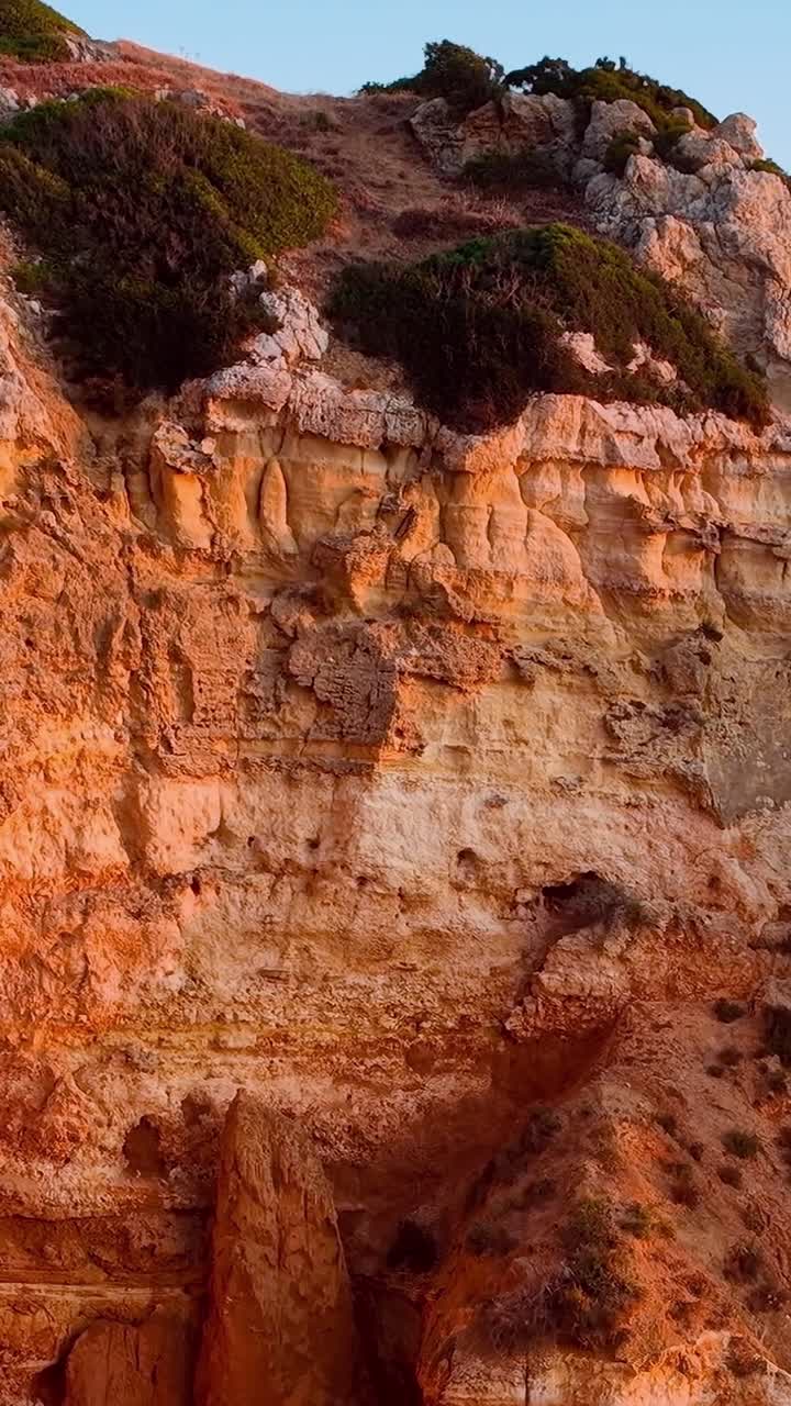Sunset over the cliffs in Portugal during summer evening